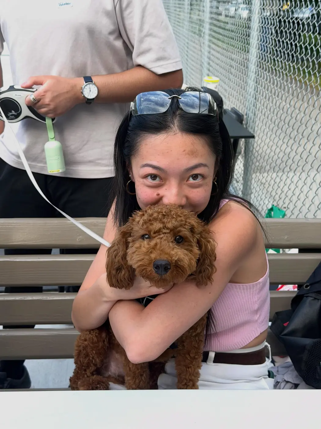 A friendly four-legged guest hanging out at the courts