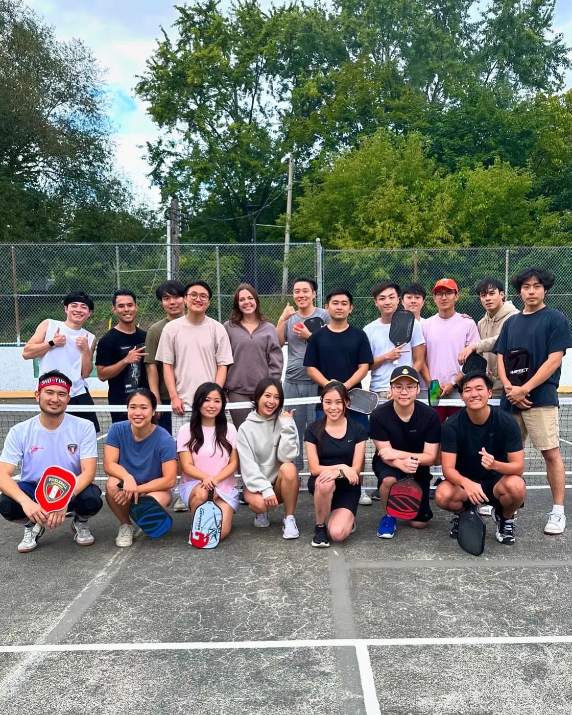 A big group of players gathered on the courts