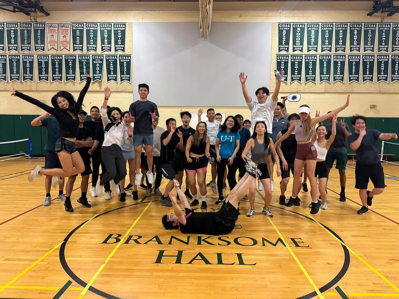 Group photo under the Branksome Hall banner